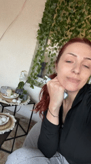 Woman takes selfies at Sofia residence, device displays ready