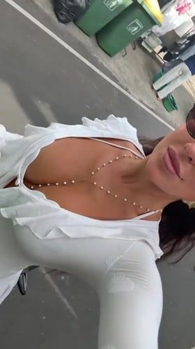 Woman takes selfies on scooter in Kuta Selatan