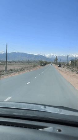 Driver records mountain scenery on Kyrgyzstan road