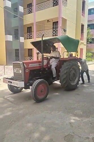 Morning scenes in Puttaparthi: tractor assistance and garden ornament