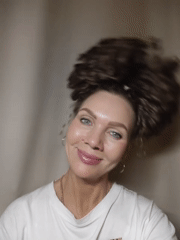 Woman with curly hair photographed multiple times indoors