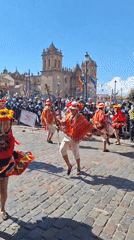 Traditional Andean festival parade through Cuzco's cobblestone streets
