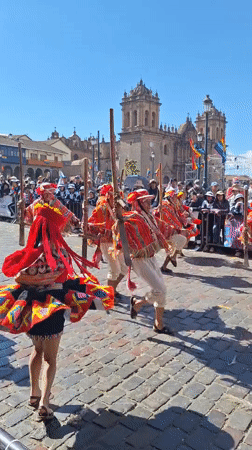 Traditional Andean festival parade through Cuzco's cobblestone streets