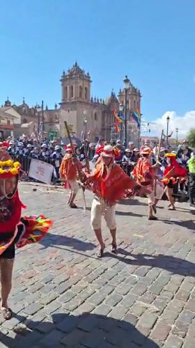 Traditional Andean festival parade through Cuzco's cobblestone streets