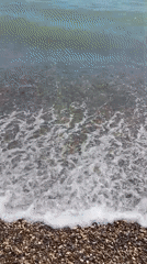 Summer beach day at Dzhubga amid visible storm damage