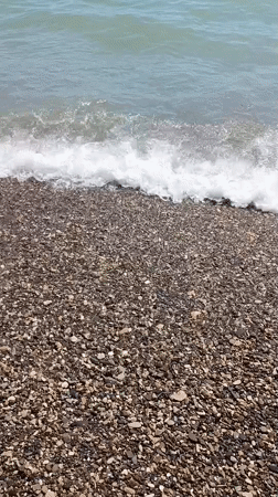 Summer beach day at Dzhubga amid visible storm damage