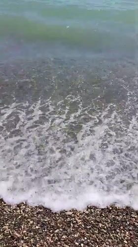 Summer beach day at Dzhubga amid visible storm damage