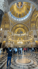 Morning visitors document Saint Sava Temple's golden mosaics in Belgrade