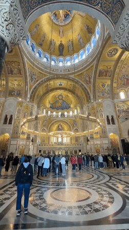 Morning visitors document Saint Sava Temple's golden mosaics in Belgrade