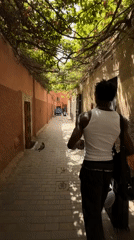 Moving through a quiet alley in Marrakesh's medina