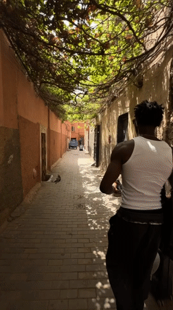 Moving through a quiet alley in Marrakesh's medina