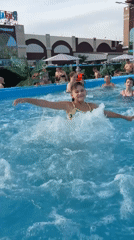 Sunny afternoon at a water park with pool and hammock time