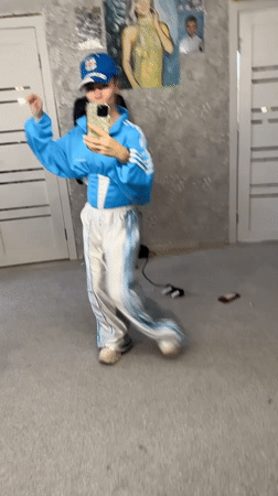 Woman records bedroom selfie videos in Abakan tracksuit session