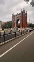 Electric scooter rider travels Barcelona bike path
