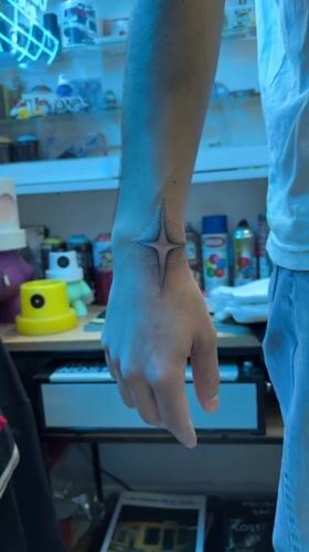 Person with star tattoo spotted near spray paint shelves