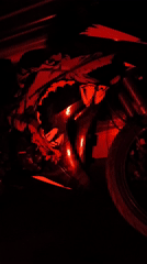 Nighttime documentation captures illuminated motorcycle and cannabis paraphernalia