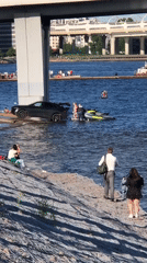 Busy afternoon on an urban waterway: boats, boards, and jet skis