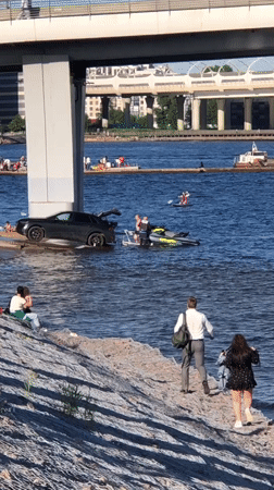 Busy afternoon on the water: jet skis, paddleboards, and boats