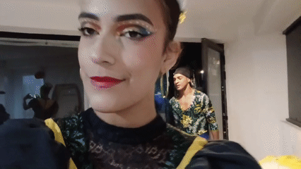 Woman records selfie videos with stage makeup at Venezuelan beach