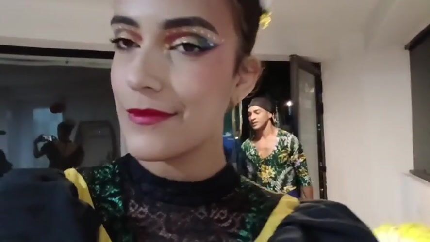 Woman records selfie videos with stage makeup at Venezuelan beach