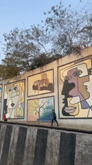 Colorful street murals featuring diverse art styles documented in Mumbai
