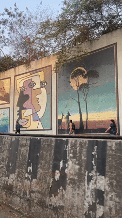 Colorful street murals featuring diverse art styles documented in Mumbai