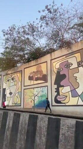 Colorful street murals featuring diverse art styles documented in Mumbai