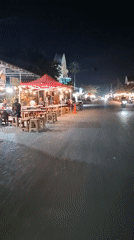 Nighttime street documentation captures evening business activity in Lhokseumawe