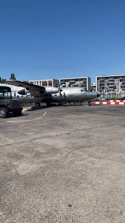 Black bus and silver plane spotted on Cologne lot