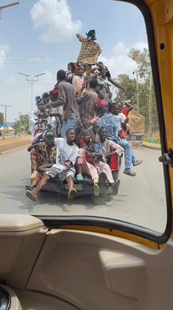 Overloaded pickup truck carries 20 passengers in Bukuru Nigeria
