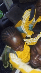 Father and children in yellow play on floor
