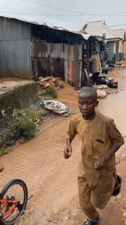 Rainy afternoon chores at a Jos residential compound