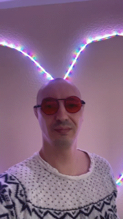 Person poses with colorful lighting in Tallinn residence