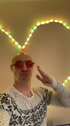 Person poses with colorful lighting in Tallinn residence