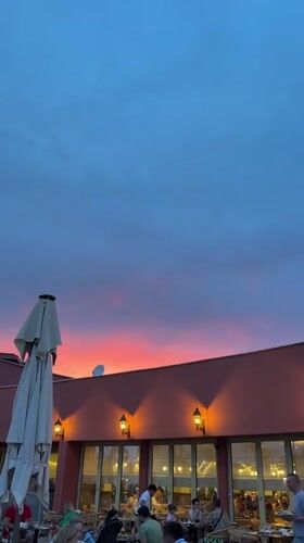 Sunset dining scene captured at Kemer rooftop restaurant