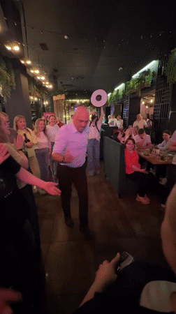 Restaurant crowd dancing and celebrating in Monchegorsk