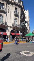 Videographer films street scene in sunny Buenos Aires