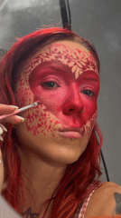 Elaborate heart-themed face paint applied step by step in Bali