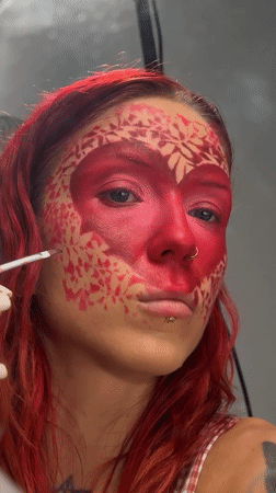 Elaborate heart-themed face paint applied step by step in Bali