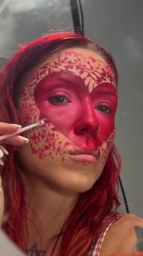 Elaborate heart-themed face paint applied step by step in Bali