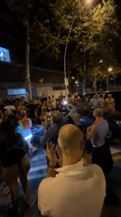 Nighttime street crowd dancing in Barcelona