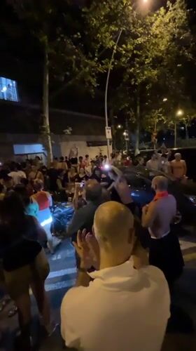 Nighttime street crowd dancing in Barcelona