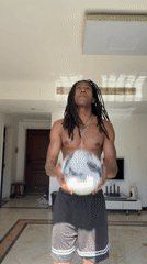Man juggles soccer ball in Binjiang apartment morning session