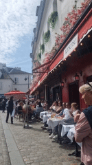 Witness documents typical Parisian street life in Montmartre