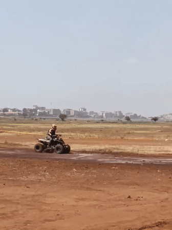 ATV dirt track race on a red clay circuit near Nairobi