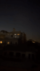 Female DJ performs evening set at Barcelona nightclub