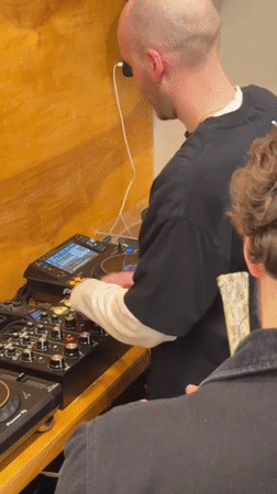 DJ performs at busy New York coffee shop