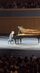 Pianist performs on grand piano for Jerusalem audience
