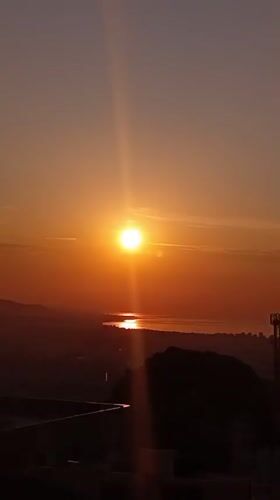 Golden hour over Barcelona's skyline and coastline