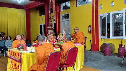 Buddhist ceremony with monks and laypeople in Magelang temple